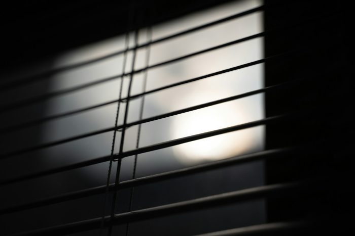 Sunlight passing through horizontal window-blind slats